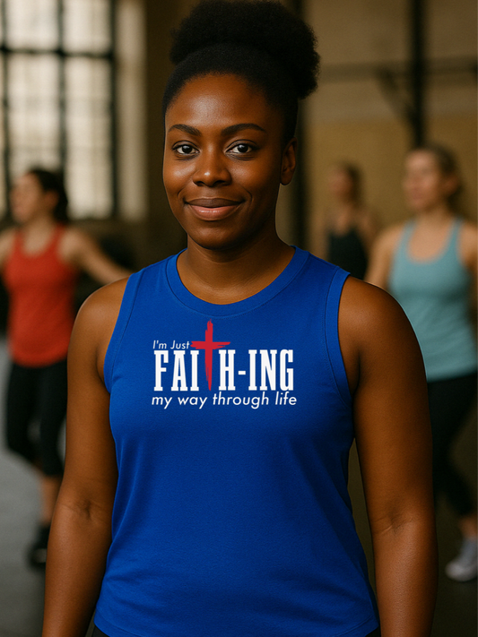 A woman standing in a gym wearing a blue muscle tank top with the text 'FAITH-ING my way through life' printed on the front.