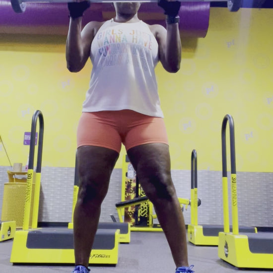 Workout video with the model wearing a social justice tank top that says Girls Just Wanna Have Fundamental Human Rights 