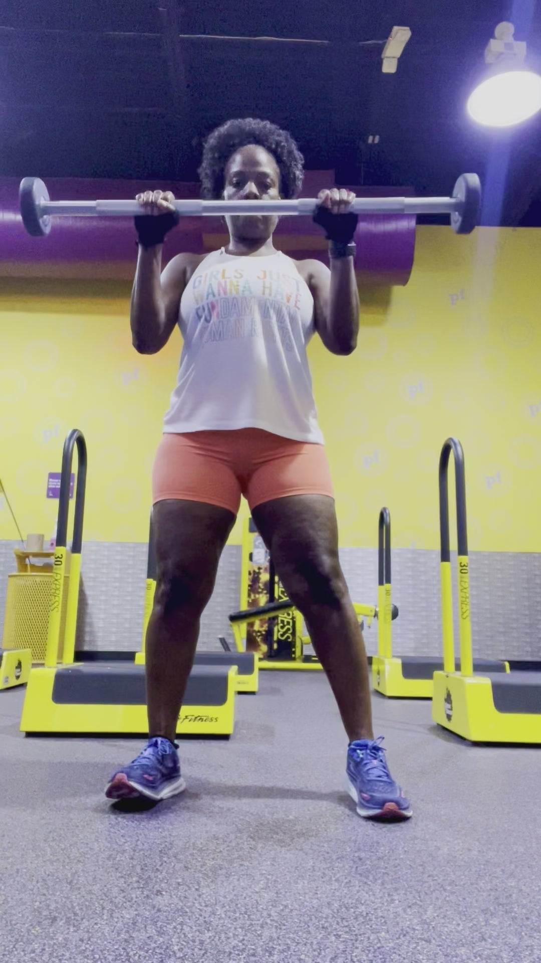 Workout video with the model wearing a social justice tank top that says Girls Just Wanna Have Fundamental Human Rights 