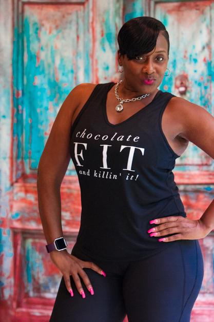 Black girl wearing a fitness black tank top - Shirt says Chocolate fit & Killin it 