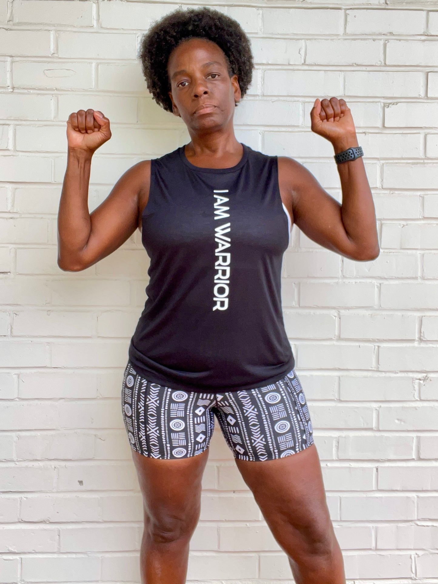 black girl wearing i am warrior fitness tank top