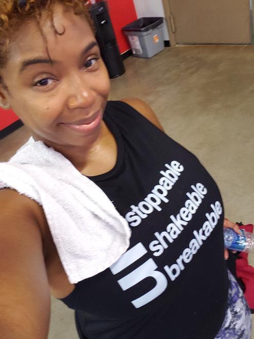 Black girl in gym wearing Un Stoppable - Shakable - Breakable Muscle Tank Muscle Tank Bella 