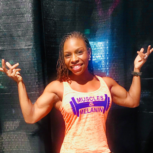 Black Girl wearing orange & purple Muscles & Melanin Tank Top